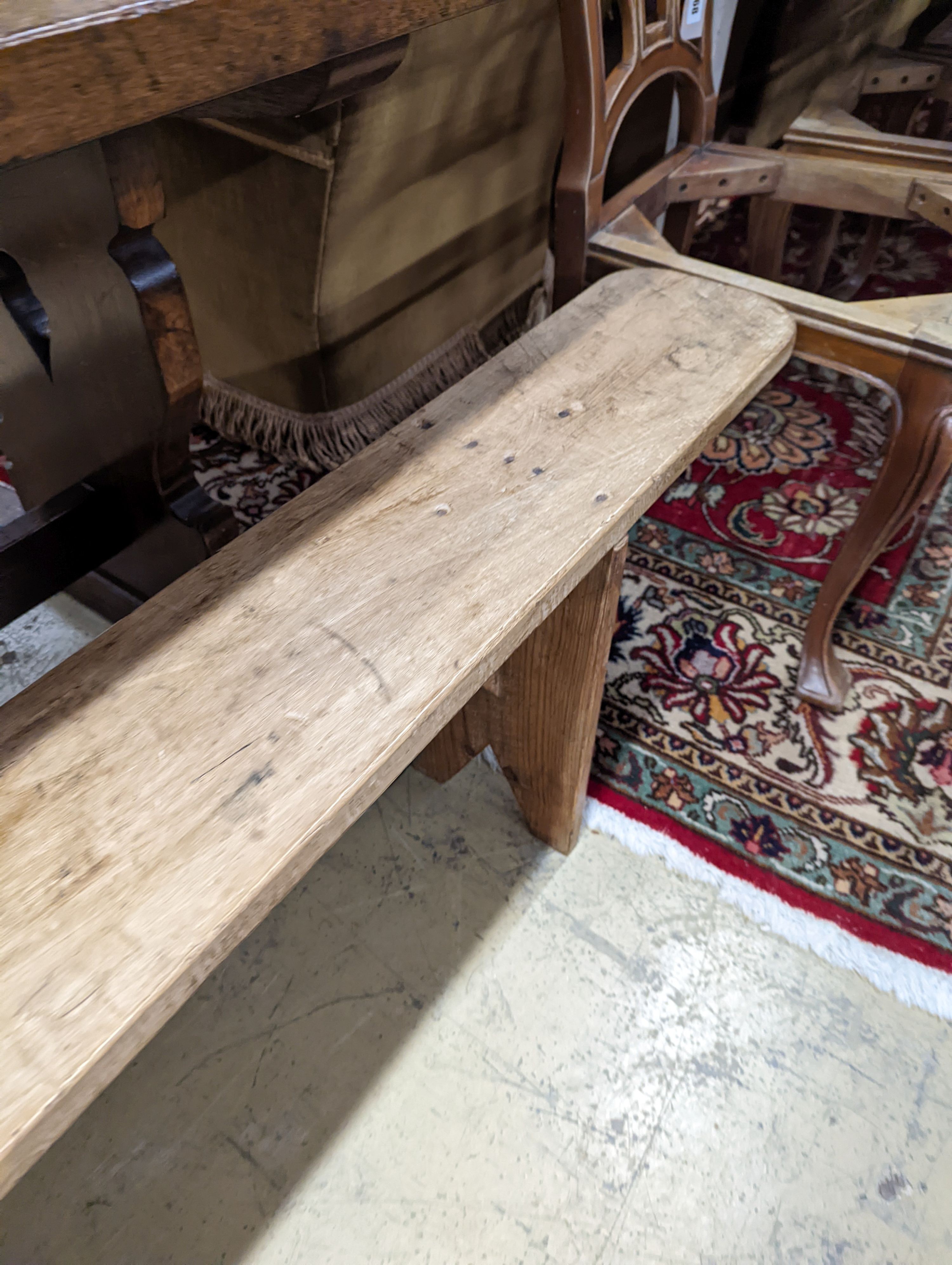 A pair of 19th century pine benches. Length-220cm, Depth-21, Height - 45cm.